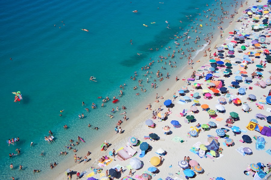 A sunny, umbrella-dotted beach day